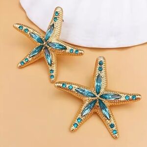 Céléna - Elegant Classic Starfish Earrings With Shiny Blue Crystals. 2025